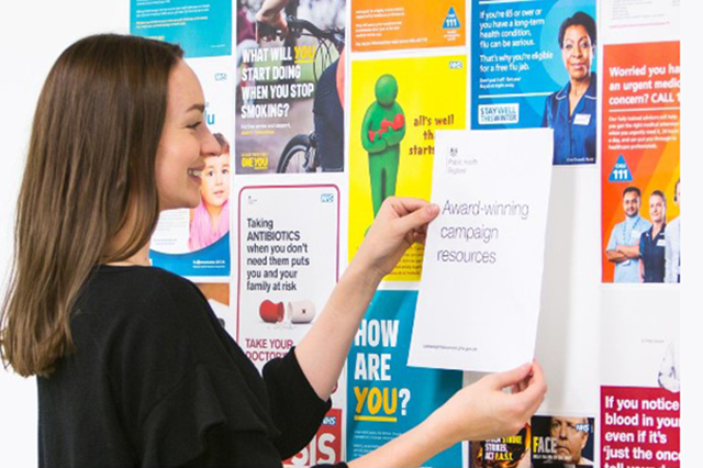 Image of woman looking at noticeboard