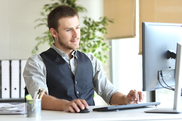 manager looking at a laptop