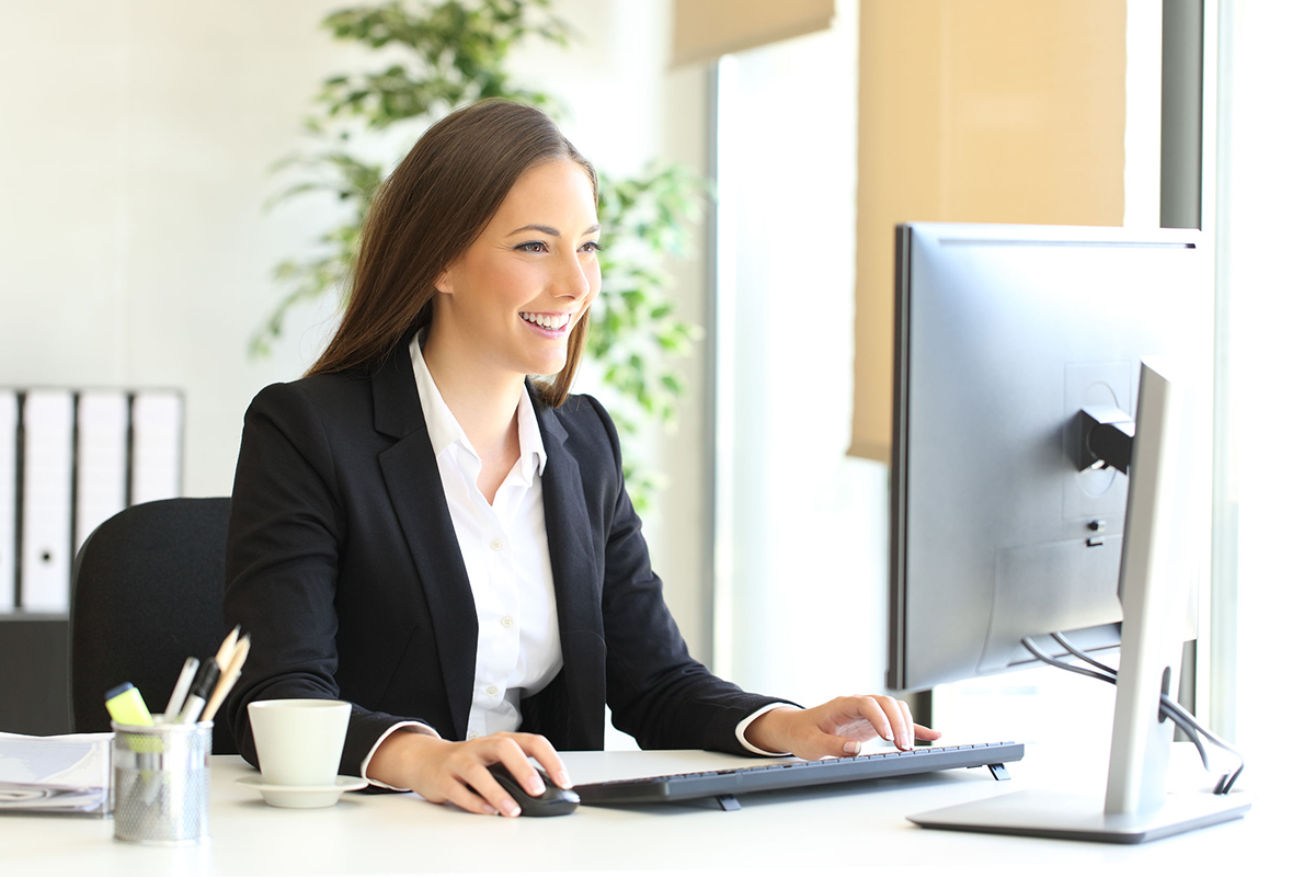 Lady manager looking at laptop screen